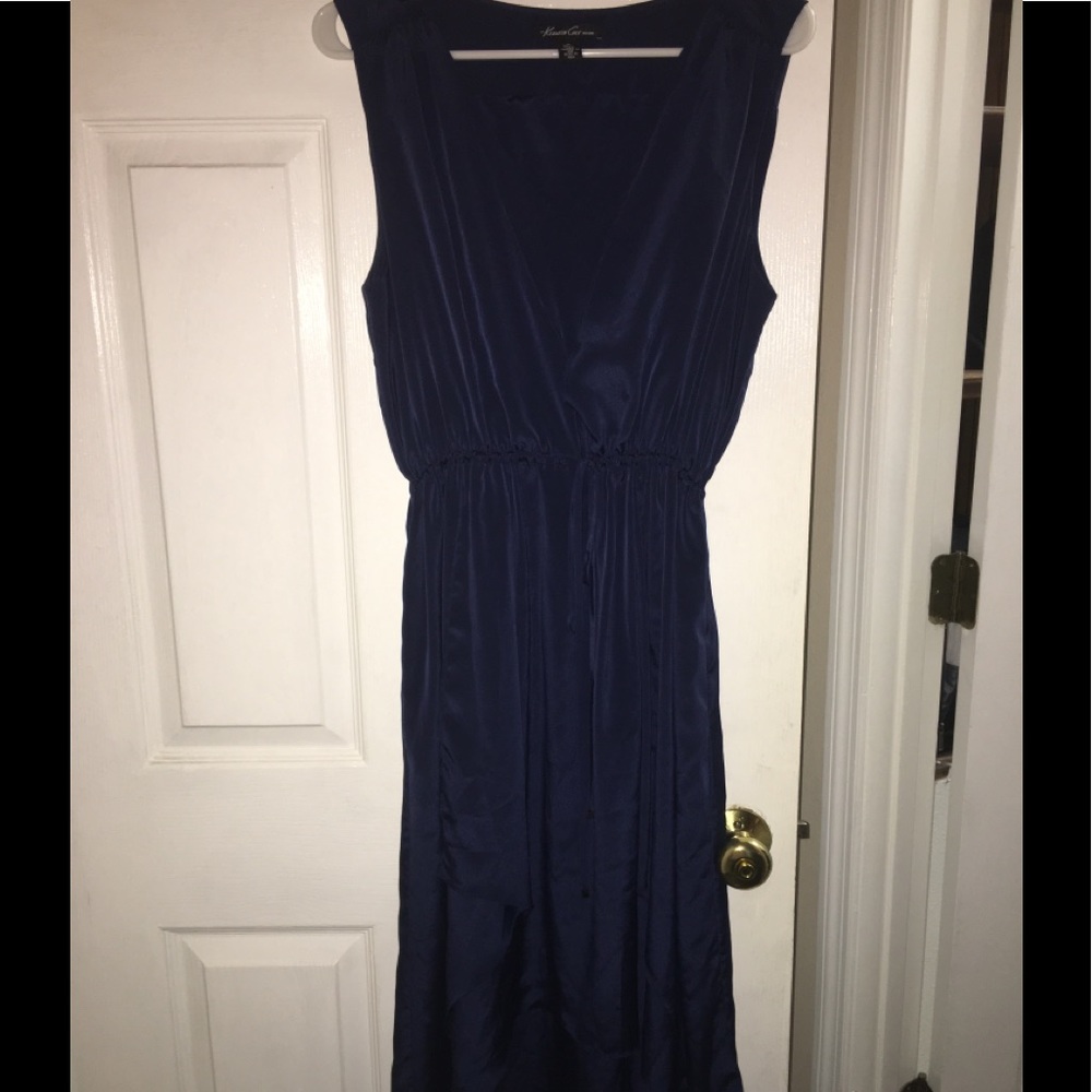 Gorgeous flowing navy dress sits at the calf